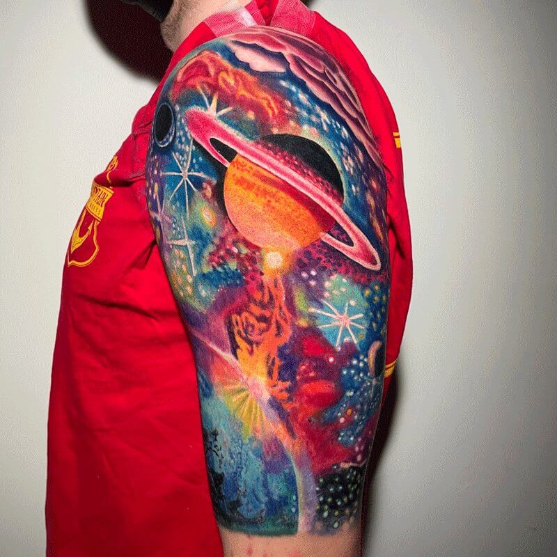 Color Planets tattoo on arm