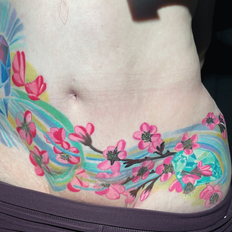 Colorful flowers body tattoo