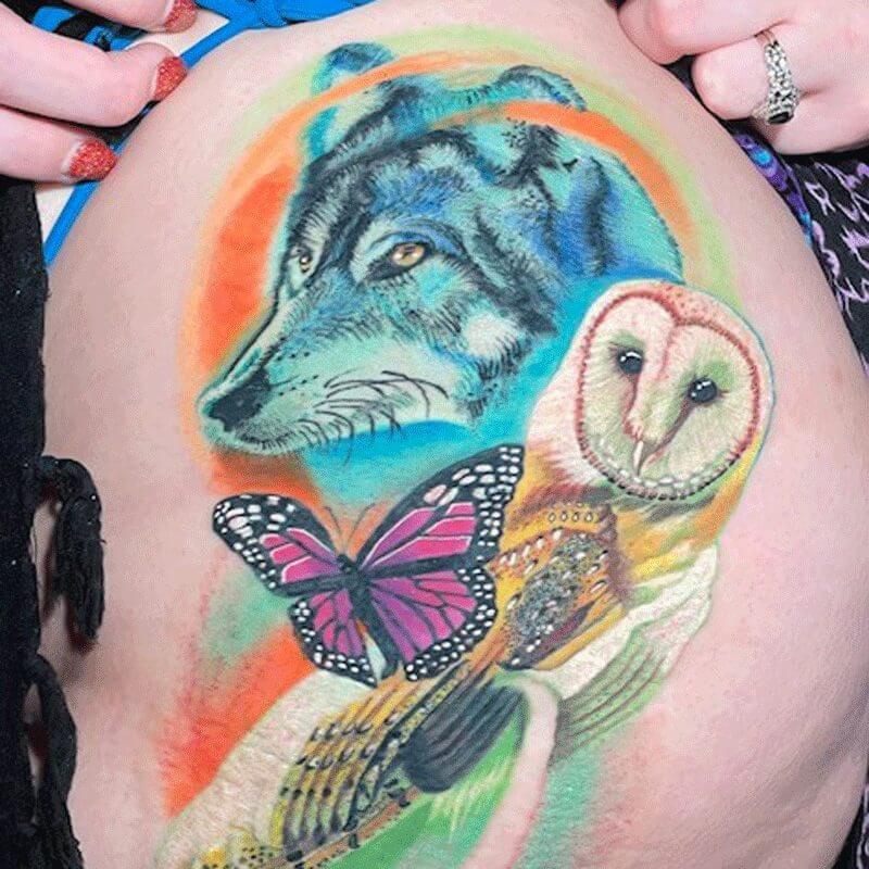 Color wolf and owl tattoo