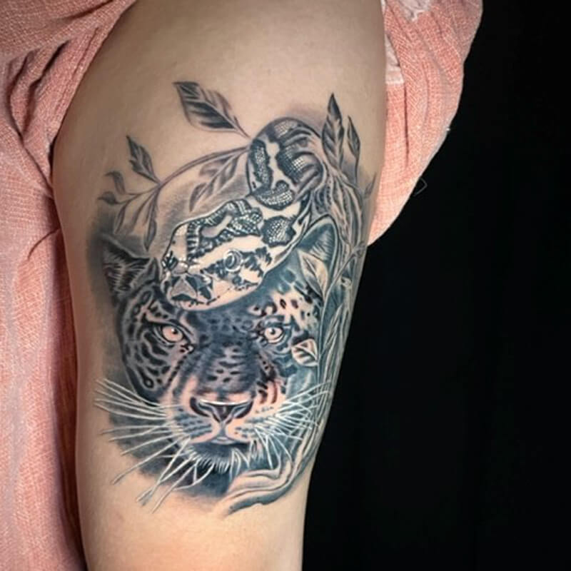 Leopard and snake on arm