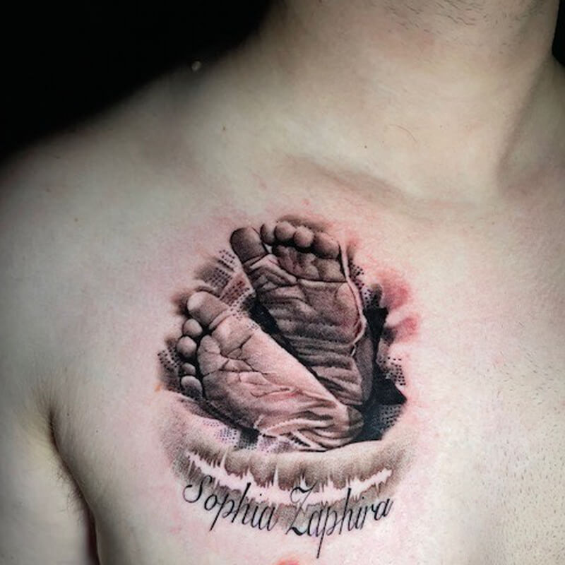 Baby feet tattoo on chest